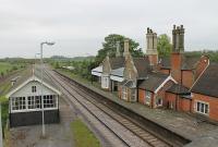 Although it closed in 1993 Brocklesby's listed station building is still in good order standing alongside the very busy junction for the Grimsby and Immingham lines. View east from the road bridge. <br><br>[Mark Bartlett 21/05/2012]