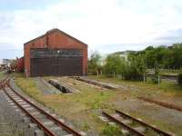 The unused country end of Vale of Rheidol's former Aberystwyth steam shed with disconnected standard gauge ash pits still in situ. Photographed on 30 May 2012 from the 10.30 service to Devils Bridge. <br><br>[David Pesterfield 30/05/2012]