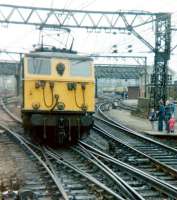 76025 approaching the platforms at Guide Bridge on 21 April 1981. The locomotive is about to take over the LCGB <I>Easter Tommy</I> railtour. The special, which had arrived from Liverpool behind a pair of class 25 diesel locomotives, was electrically hauled from here via Woodhead as far as Rotherwood sidings. [See image 19204]<br><br>[Colin Alexander 21/04/1981]