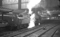 Kingmoor shed's Ivatt 2-6-0 no 43103 stands at Carlisle platform 4 on 14 March 1964 with a Langholm train.<br><br>[K A Gray 14/03/1964]