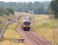 A train from Dalmuir approaching Chatelherault station on the south eastern outskirts of Hamilton in August 2006, some 9 months after the reopening of the line south to Larkhall.<br><br>[John Furnevel 14/08/2006]