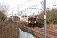 SPT liveried 318267 pulls away from Holytown station in February 2006 with a Milngavie - Lanark service.<br><br>[John Furnevel 13/02/2006]