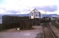A Class 24 shunts Invergordon goods yard in the mid 1970s.<br><br>[David Spaven //]
