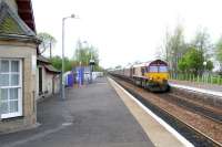 EWS 66225 brings a coal train through West Calder station on a May morning in 2005 heading in the Edinburgh direction. <br><br>[John Furnevel 01/05/2005]