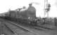 Ex-NBR no 256 <I>Glen Douglas</I> with <I>Scottish Rambler No 3</I> on the level crossing at Kincardine station on 30 March 1964 during the leg from Dunfermline to Alloa. [See image 6479]<br><br>[K A Gray 30/03/1964]