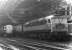 Brush type 4 no 1777 about to take a train out of Liverpool Street station in March 1970. In the background is one of the less than successful BTH Type 1 locomotives no D8234, put to work by Stratford shed that day as station pilot. This particular example was withdrawn the following March after ten and a half years operational service. <br><br>[John Furnevel 10/03/1970]