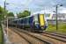 Nearing its destination at Ayr on 20 July 2012, unit 380111 emerges from under John Street road bridge.<br><br>[Bill Roberton 20/07/2012]