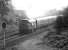 The early evening sun catches Holbeck 'Peak' 190 as it runs past the site of Inveresk goods yard with the 17.10 Edinburgh - Leeds service on 7 May 1970. In the background above the train are the semaphores controlling the freight-only line to Smeaton which has diverged from the ECML at Monktonhall Junction, just off picture to the right.<br><br>[John Furnevel 07/05/1970]