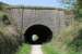 Newhaven Tunnel is on the High Peak Trail just to the south of the junction with the Tissington Trail. It carries the A515 Buxton to Ashbourne road over the old line and bears stone plaques over each portal commemorating its construction in 1825. View towards Parsley Hay.<br><br>[Mark Bartlett 24/05/2012]