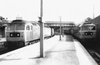 View back towards the main station from the south end of platform 1 at Dundee in September 1981. 47119 waits in the bay with a Dundee - Glasgow Queen Street service while 47160 calls at platform 1 with an Aberdeen - Birmingham train.<br><br>[John Furnevel 25/09/1981]