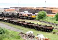 Coal empties and steel pipe flats at Leith South yard on 9 June 2005 with one or two of said steel pipes forming the backdrop. <br><br>[John Furnevel 09/06/2005]