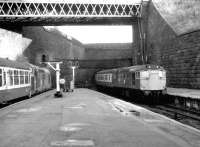 A Type 2 emerges with a train out of Queen Street Tunnel in the spring of 1981, passing 37035 preparing to depart for Oban.<br><br>[John Furnevel 05/05/1981]