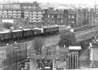 25026 has just passed the site of Gorgie East station on the Edinburgh 'sub' with a northbound freight on 14 April 1981. The train is about to cross the bridge over Gorgie Road before taking the left fork at Gorgie Junction to join the E&G main line at Haymarket West.<br><br>[John Furnevel 14/04/1981]