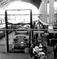 View out from the concourse at Liverpool Street station on 25 April 1972, with a train for King's Lynn boarding at platform 7.<br><br>[John Furnevel 25/04/1972]