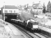Clayton 8582 with a westbound freight passing Morningside Road station on the Edinburgh <I>sub</I> in July 1971.<br><br>[John Furnevel 20/07/1971]