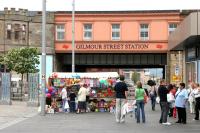East end of Gilmour Street station on Saturday 30 July 2005 with a colourful street market trader in operation. View is north from County Square.<br><br>[John Furnevel 30/07/2005]
