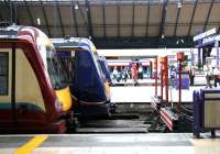 Three liveries. Scene at the buffer stops at Glasgow Queen Street in July 2005.<br><br>[John Furnevel 30/07/2005]