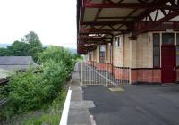 The abandoned through platform with track lifted on the north side of Dumbarton Central in July 2005 looking towards Glasgow. The adjacent platform to the right is currently platform 1.<br><br>[John Furnevel 10/07/2005]