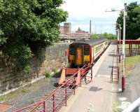 Glasgow Central service waiting at Paisley Canal in July 2005. Looking east from the steps up to the road bridge.<br><br>[John Furnevel 29/07/2005]