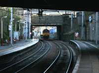 A class 66 heading north 'light engine' on the WCML through the dark cavern of Motherwell station in February 2006.<br><br>[John Furnevel 25/02/2006]