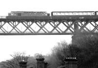 Edinburgh - Aberdeen train above the rooftops of South Queensferry in 1982 on the approach to the Forth Bridge.<br><br>[John Furnevel 25/10/1982]