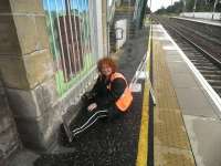 Artist Adele Conn seen here on 18 September 2011 at work on her new mural at Prestonpans station. [See news item] [See image 34627 for wide view of mural]<br><br>[John Yellowlees 18/09/2011]