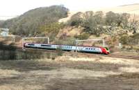 A Voyager at speed just north of Grantshouse in March 2004.The line runs parallel with the A1 at this point.<br><br>[John Furnevel 16/03/2004]