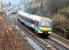 Edinburgh - Glasgow trains passing at Polmont in November 2002.<br><br>[John Furnevel 22/11/2002]