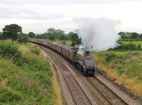 Nearing the summit at Hoghton on 18th August, no 60009 is working hard with the 12 coach outward <I>'Cumbrian Mountain Express'</I> and an idling Class 47 on the rear. The 3-cylinder beat and chime whistle of the A4 could be heard long before it appeared round the curve. <br><br>[Mark Bartlett 18/08/2012]