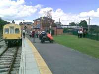 Despite the Ecclesbourne Valley Railway having no physical connection with Network Rail, a <I>'junction'</I> station has been created at Duffield, with main line interchange. Here an EVR Metropolitan Cammell DMU is seen at Duffield connecting with an East Midlands Class 156 on a Matlock service. The heritage set will return to Wirksworth along the 10 mile preserved line.<br><br>[Malcolm Chattwood 14/08/2012]