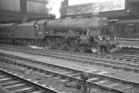 Carrying the headboard of 'The Waverley', Royal Scot no 46130 <I>The West Yorkshire Regiment</I> stands at Carlisle platform 4 ready to take out the 10.05 Edinburgh Waverley - London St Pancras on 1 July 1961. On this occasion, for reasons unknown, locomotive changeover had taken place earlier at Canal Junction.<br><br>[K A Gray 01/07/1961]