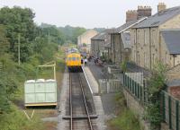 Leyburn station, seen from the overbridge looking east in August 2012, with a Wensleydale Railway DMU waiting to depart for Redmire. As the line now hosts steam as well as diesel services the redundant loop track has been lifted and watering facilities installed. [See image 1451].<br><br>[Mark Bartlett 11/08/2012]