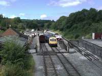 A general view of Wirksworth station from the overbridge with a 3-car DMU about to depart for the junction at Duffield. On the right is the platform serving the short 1:30 branch to Ravenstor with an elaborate trap point arrangement in place for any <I>overshoots</I>. [See image 35791]<br><br>[Malcolm Chattwood 14/08/2012]