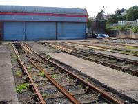 The east end of the former six (now five) road Barry steam shed (88C) and yard, now run by Cambrian Transport as a base for the Vale of Glamorgan Steam Railway. Barry (Town) station canopy is visible at a higher level on the right.<br><br>[David Pesterfield 30/08/2012]