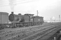 Activity at the north end of Heaton yard in the sixties. The locomotive is J27 0-6-0 no 65831, which spent all its BR years at North Blyth until eventual withdrawal in February 1966. Note the Wills cigarette factory in the background on the other side of the Coast Road.<br><br>[K A Gray //]