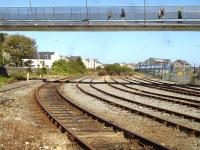 Redundant sidings at the west end of the ecs stabling area at Holyhead in September 2012. Alongside on the left is the longer wash plant run through line. The new footbridge links the Stena terminal and west end of platform 1 with the town's main shopping area. [See image 40291] <br><br>[David Pesterfield 05/09/2012]