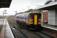 153315 arrives in Barrow on a very wet morning, clearing the single line section from Askam for a Carlisle service to go forward. Just beyond the platform end the refuelling and stabling point (BW) is still in use, albeit empty during the daytime. <br><br>[Mark Bartlett 20/09/2012]