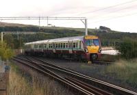 During the early evening of 22 September 2012, a train bound for Helensburgh Central slows for the stop at Craigendoran, shortly after passing the junction with the West Highland Line. <br><br>[John McIntyre 22/09/2012]