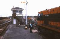 Token exchange alongside Claremorris signal box in July 1988.<br><br>[Ian Dinmore /07/1988]