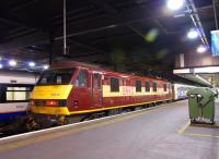 Having brought the ecs for the Highland Sleeper into platform 15 at Euston, 90028 now waits for the train to depart before going onto the front of the Lowland Sleeper.<br><br>[John McIntyre 10/10/2012]