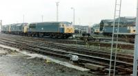 Various diesel locomotive types standing in the shed yard at Gateshead in 1981 with no 56063 occupying centre stage. This particular example was involved in crew training prior to GD receiving its own allocation of the class.<br><br>[Colin Alexander //1981]