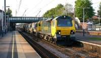 Freightliner 70016 runs south through Leyland on 21 May 2012 heading for Crewe Basford Hall yard with a Network Rail engineers train of auto-ballasters and ballast wagons. <br><br>[John McIntyre 21/05/2012]