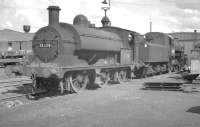Aspinall ex-LYR Class 23 0-6-0ST no 11324 with Ivatt 4MT 4-6-0 no 43063 in the yard at Horwich Works in June 1963. The former was one of a number of the class retained for use as departmental locomotives within the works.<br><br>[K A Gray 22/06/1963]