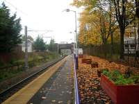 Autumn leaves at Crookston on 22 October 2012. View is east towards Glasgow Central, with overhead equipment now in place as part of the electrification of the Paisley Canal branch.<br><br>[John Yellowlees 22/10/2012]