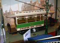 One of the two trams that linked the GNSR Cruden Bay Hotel and Cruden Bay station on display at the Grampian Transport Museum, Alford, in October 2012. Car No 2 is beautifully restored to a very high standard and is displayed in front of a large image of the hotel. Cruden Bay hotel closed in 1948 and was subsequently demolished.  <br><br>[John McIntyre 16/10/2012]