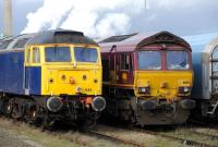 Locomotives 47843 and 66182 stabled in the station sidings at Didcot on 1 November.<br><br>[Peter Todd 01/11/2012]