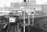 A murky Monday in May 1971 sees a pair of EE Class 50s lifting a mid-morning Glasgow Central - London Euston train out of Carlisle station. The train is about to cross the bridge over the goods lines. [See image 5345]<br><br>[John Furnevel 24/05/1971]