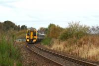 With the remains of Kintore station platform behind the photographer, an Inverness service disappears towards Inverurie on 19 October 2012. The line to Alford curved away to the left at this point and is still identifiable as such for a short distance.<br><br>[John McIntyre 19/10/2012]