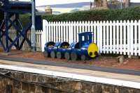 <I>'The train standing on platform 2 is not in service.....but is in bloom!'</I> A tidy and well looked after station with an appropriate set of flower tubs. Platform scene at Insch on 16 October 2012.<br><br>[John McIntyre 16/10/2012]