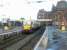 334006 at Ayr platform 2 with a train for Glasgow Central. Photographed on a wet morning in July 2002.<br><br>[John Furnevel 12/07/2002]